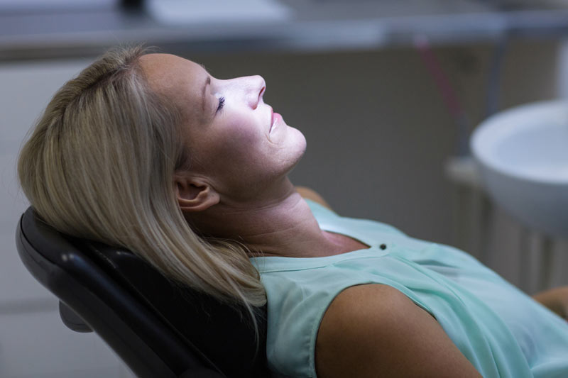 woman sedated at the dentist office