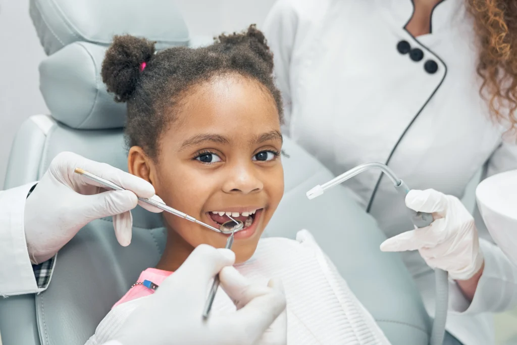 happy-afro-kid-regular-check-up-teeth-dental-clinic